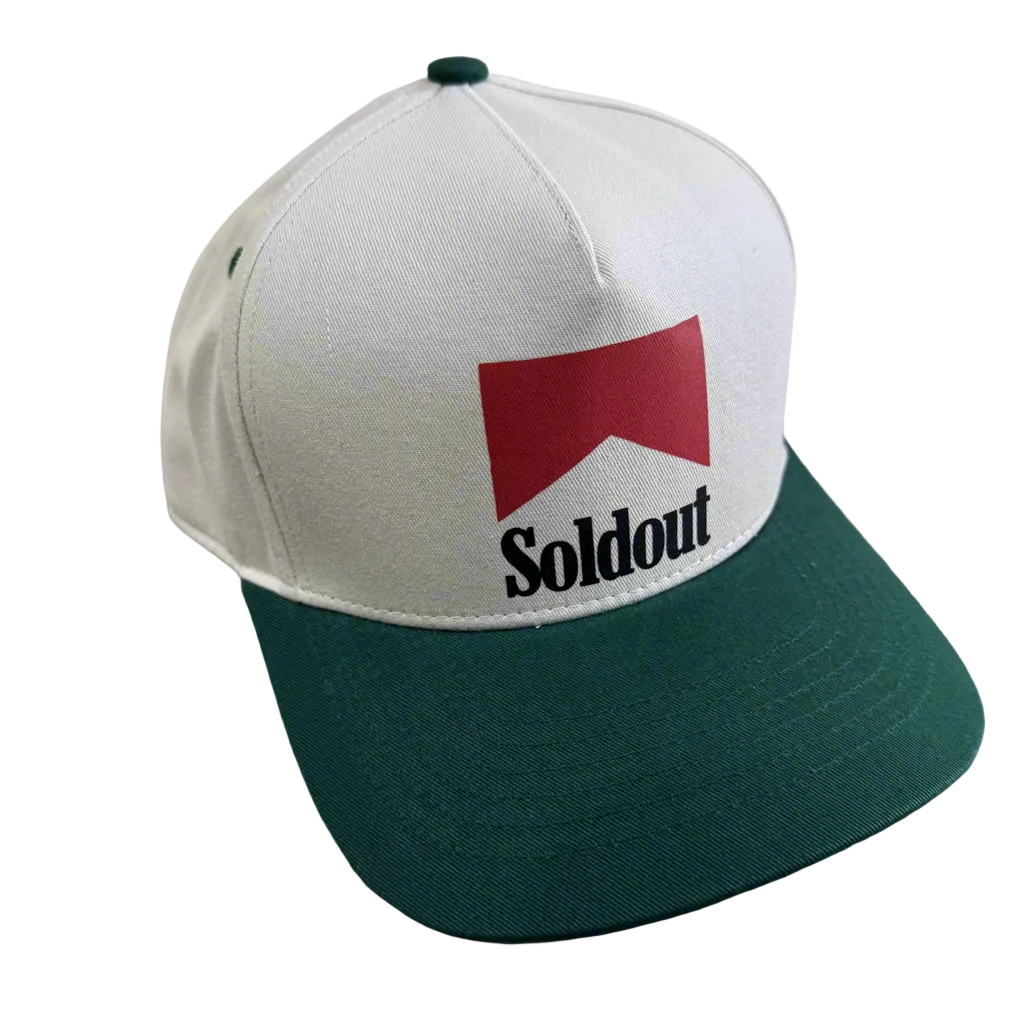 Sold Out Society cream and green snapback hat with embroidered red logo and green brim