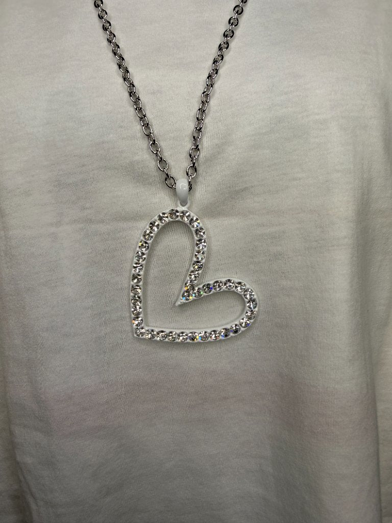 Black iced out cross necklace flat wide arm black crystals on white tee
