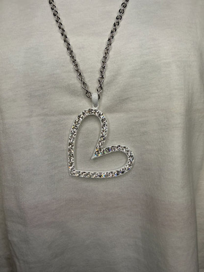 Black iced out cross necklace flat wide arm black crystals on white tee
