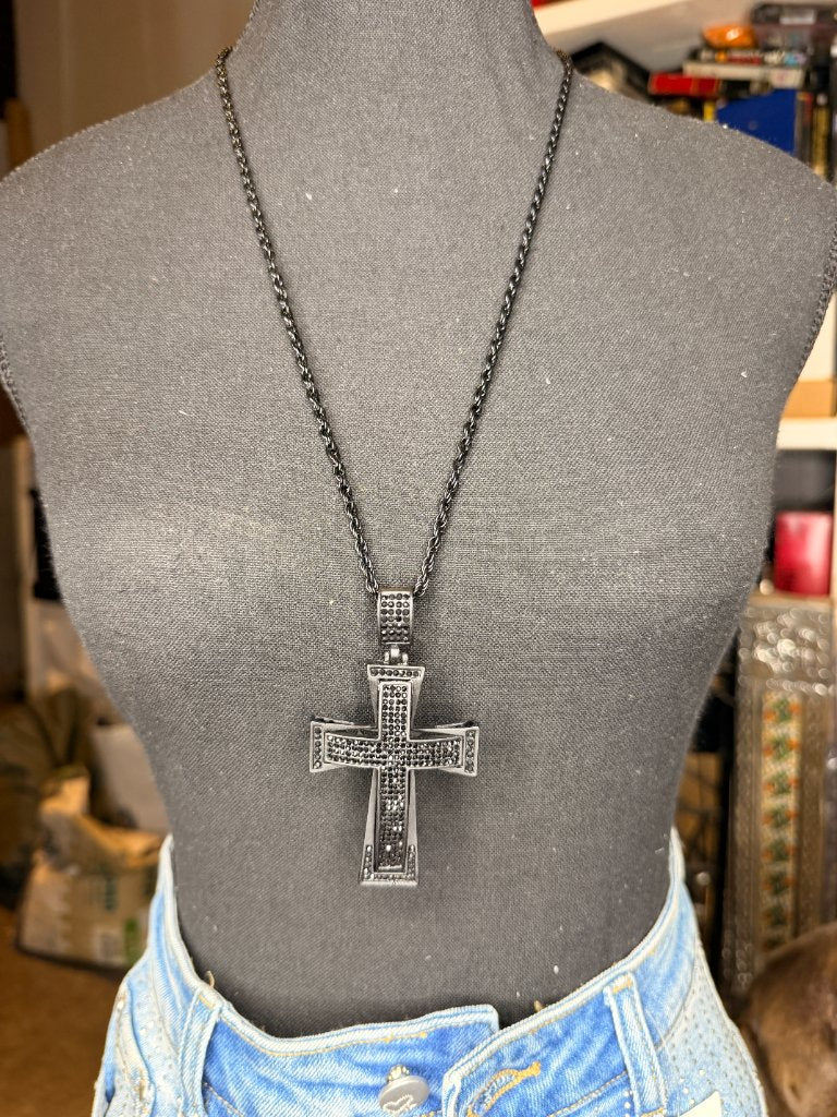 Black iced out rectangular cross necklace full length on white tee