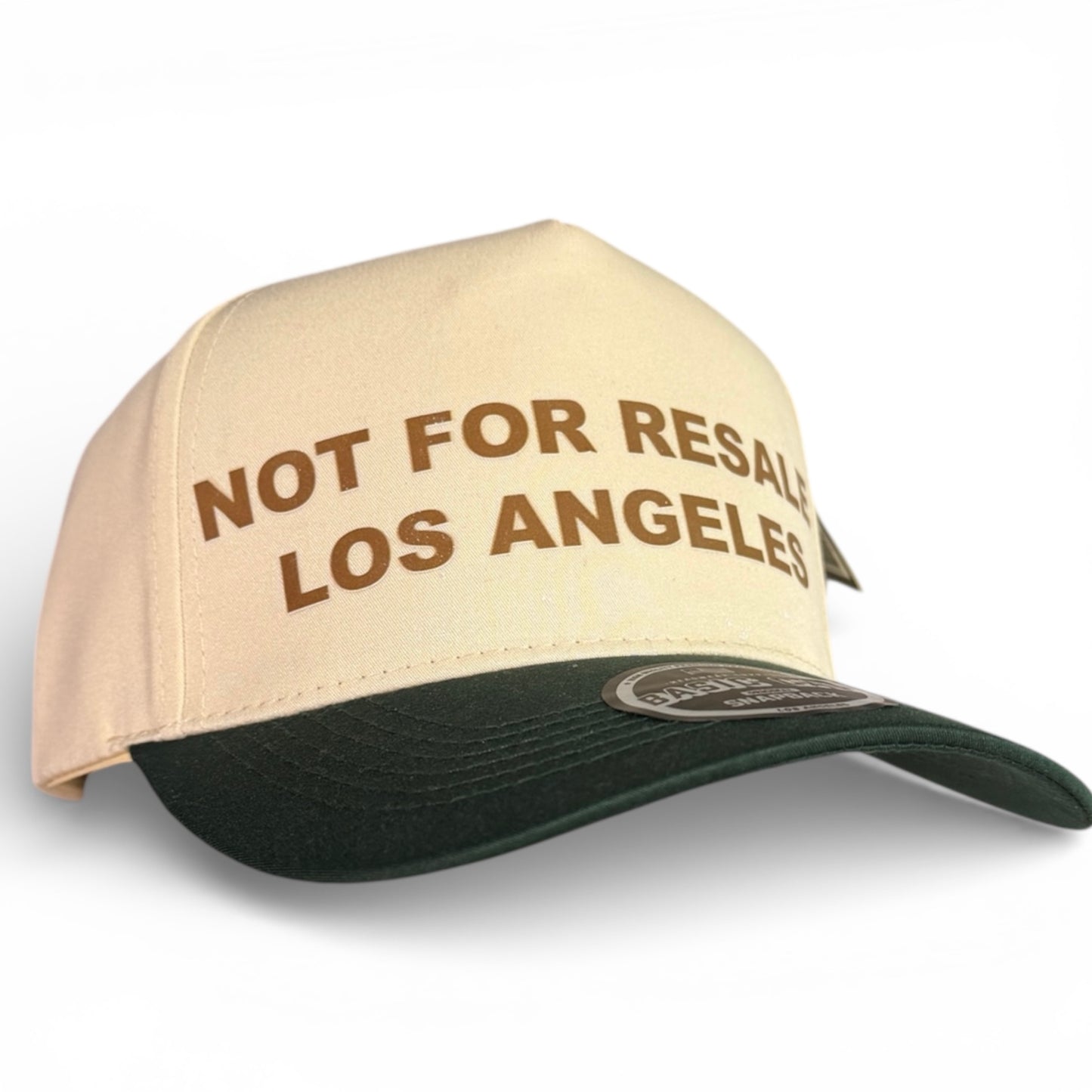 Not For Resale Los Angeles cream snapback hat with green brim and brown lettering