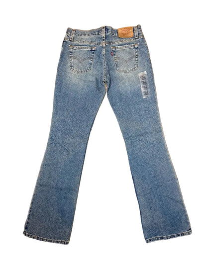 vintage Levi's 505 straight leg jeans light wash back view tag visible downtown LA thrift